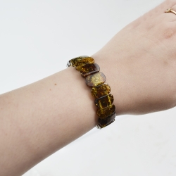Classic shape medium green amber bracelet
